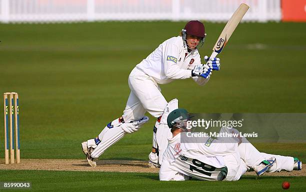 David Willey of Northamptonshire hits the ball past Tom New of Leicestershire during the LV County Championship Division Two match between...
