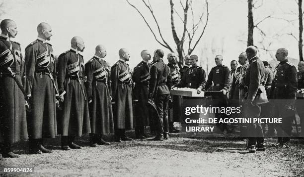 Czar Nicholas II , visiting the eastern front, distributing decorations to the Cossacks, World War I, from L'Illustrazione Italiana, Year XLIII, No...