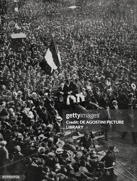 Prime Minister Paolo Boselli , on a visit to Milan, followed by a procession of people from the station to the hotel, Italy, World War I, photo by...