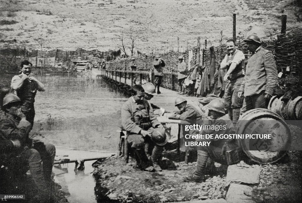 Soldiers resting near a footbridge over the Isonzo river, Italy, World War I, from L'Illustrazione Italiana, Year XLIV, No 28, July 15, 1917