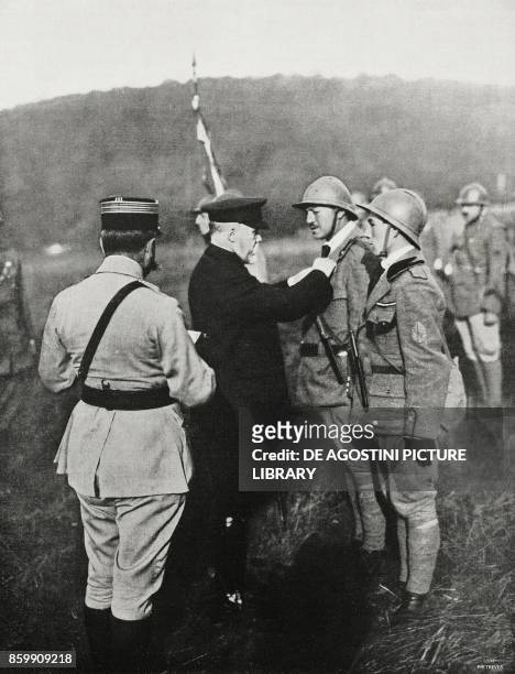 French President Raymond Poincare handing over the war cross to the officers of an assault battalion, France, World War I, from l'Illustrazione...