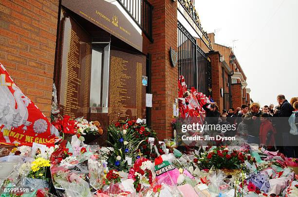 Tributes to the 96 adorn the Shankly Gates during the Hillsborough memorial service at Anfield on April 15 Liverpool, England. Thousands of fans,...