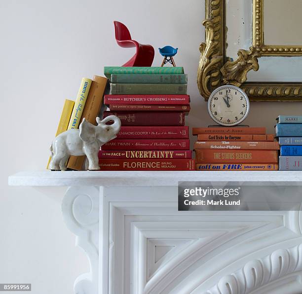 books on a mantel - mantelpiece stock pictures, royalty-free photos & images