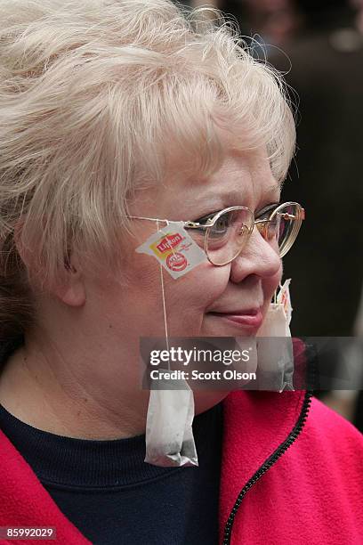 With tea bags hanging from her glasses, Marianne O'Neil participates in a Tea Party protest at the Federal Building Plaza April 15, 2009 in Chicago,...