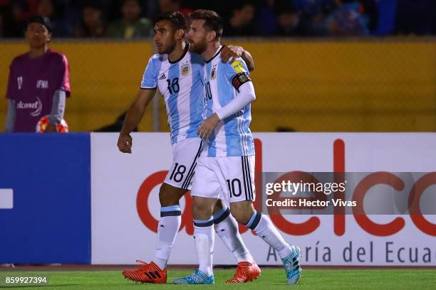 Lionel Messi of Argentina celebrates with teammate Eduardo Salvio after scoring the second goal of his team during a match between Ecuador and...