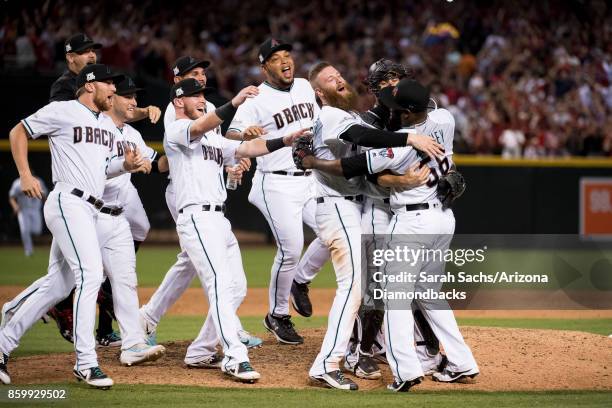 The Arizona Diamondbacks celebrate after defeating the Colorado Rockies in the National League Wild Card Game at Chase Field on October 4, 2017 in...