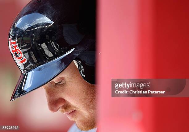 Khalil Greene of the St. Louis Cardinals waits to bat in the dugout during the game against the Arizona Diamondbacks at Chase Field April 15, 2009 in...