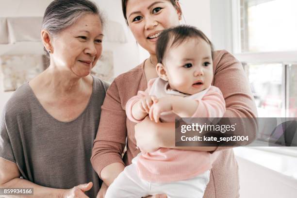 granda with granddaughter - filipino family stock pictures, royalty-free photos & images