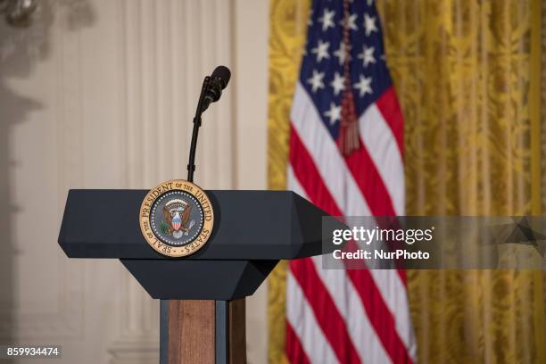 An empty podium where President Donald Trump will stand to honor the 2017 Stanley Cup Champion Pittsburgh Penguins, in the East Room of the White...