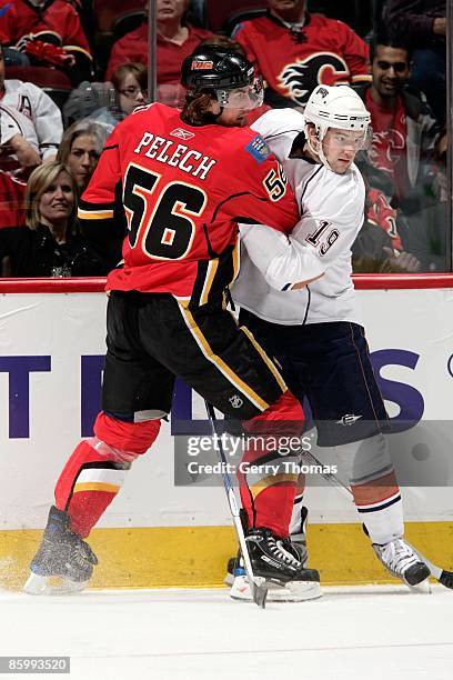 Matt Pelech of the Calgary Flames skates against Patrick O'Sullivan of the Edmonton Oilers on April 11, 2009 at Pengrowth Saddledome in Calgary,...