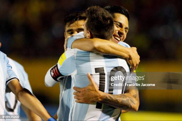 Lionel Messi of Argentina celebrates with teammate Enzo Perez after scoring the second goal of his team during a match between Ecuador and Argentina...