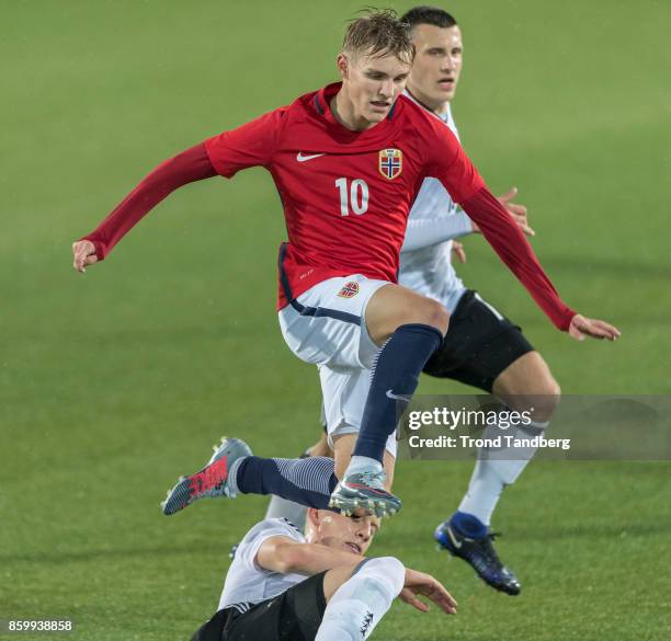 Martin Odegaard of Norway, Maximillian Eggestein, Timo Baumgarti of Germany during the U-21 FIFA 2018 World Cup Qualifier between Norway and Germany...