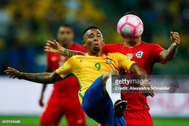 Gabriel Jesus of Brazil and Gary Medel of Chile in action during the match between Brazil and Chile for the 2018 FIFA World Cup Russia Qualifier at...