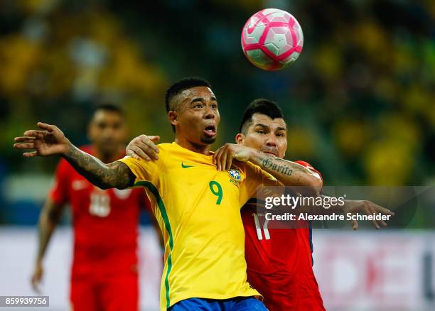 Gabriel Jesus of Brazil and Gary Medel of Chile in action during the match between Brazil and Chile for the 2018 FIFA World Cup Russia Qualifier at...