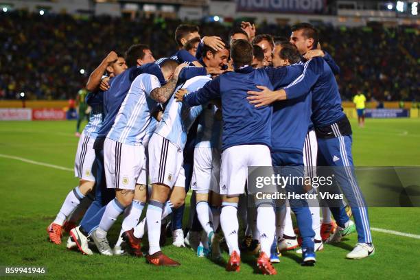 Lionel Messi of Argentina celebrates with teammates after scoring the third goal of his team during a match between Ecuador and Argentina as part of...