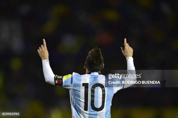 Argentina's Lionel Messi celebrates after scoring his third goal against Ecuador during their 2018 World Cup qualifier football match in Quito, on...