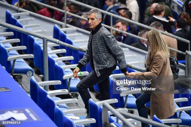 French tv presenter Nagui and his wife Melanie Page after the Fifa 2018 World Cup qualifying match between France and Belarus on October 10, 2017 in...