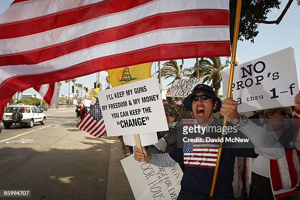 Juan Bedoya, an immigrant from Colombia, demonstrates at an American Family Association -sponsored T.E.A. Party to protest taxes and economic...