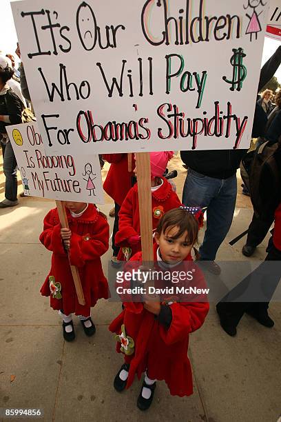 Five-year-old Katerina Demetriades and her sisters attend an American Family Association -sponsored T.E.A. Party to protest taxes and economic...