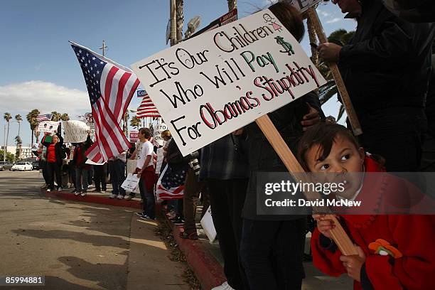 Five-year-old Katerina Demetriades attends an American Family Association -sponsored T.E.A. Party to protest taxes and economic stimulus spending...