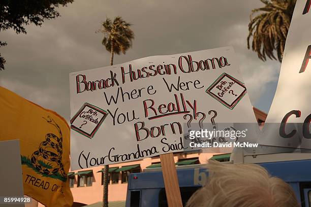 Demonstrator questions the citizenship of President Obama at an American Family Association -sponsored T.E.A. Party to protest taxes and economic...