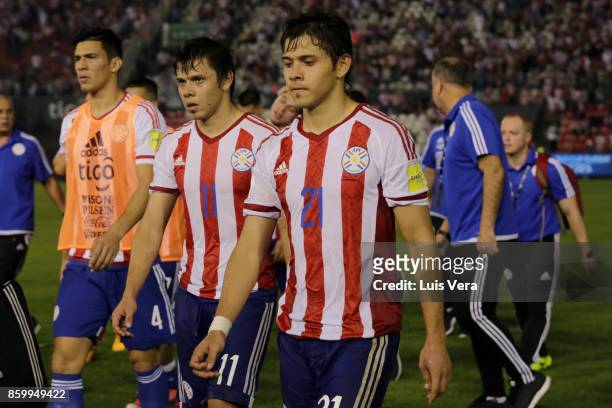 Oscar Romero and Angel Romero of Paraguay look dejected after losing a match between Paraguay and Venezuela as part of FIFA 2018 World Cup Qualifiers...