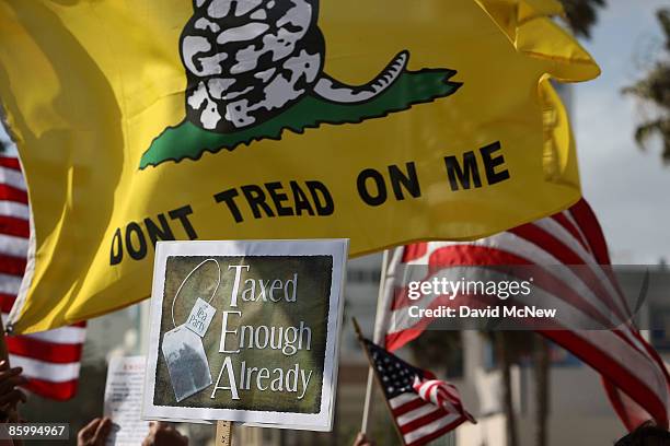 Demonstrators gather at an American Family Association -sponsored T.E.A. Party to protest taxes and economic stimulus spending on the last day to...