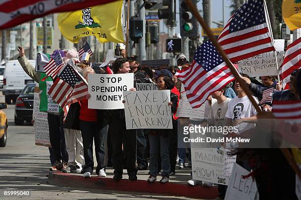 Demonstrators gather at an American Family Association -sponsored T.E.A. Party to protest taxes and economic stimulus spending on the last day to...