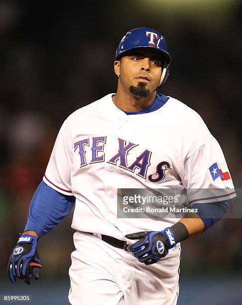Nelson Cruz of the Texas Rangers runs after hitting a grandslam while wearing jersey to commemorate Jackie Robinson day during a game against the...