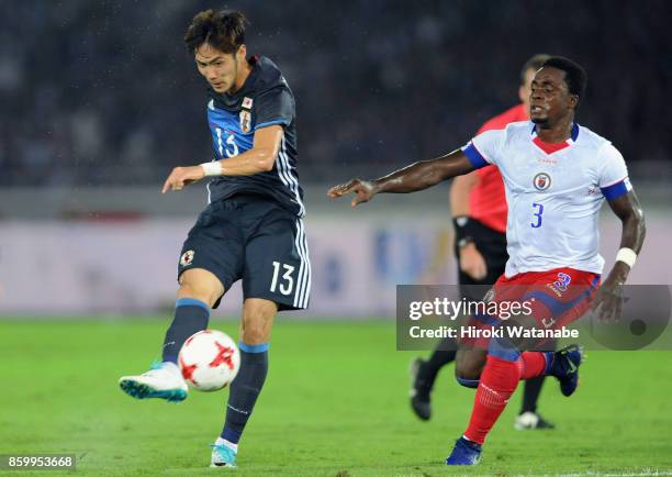 Kenyu Sugimoto of Japan shoots at goal during the international friendly match between Japan and Haiti at Nissan Stadium on October 10, 2017 in...