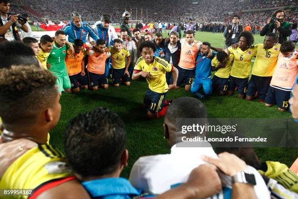 Juan Cuadrado of Colombia celebrates with teammates the qualifying to the World Cup Russia 2018 after the match between Peru and Colombia as part of...