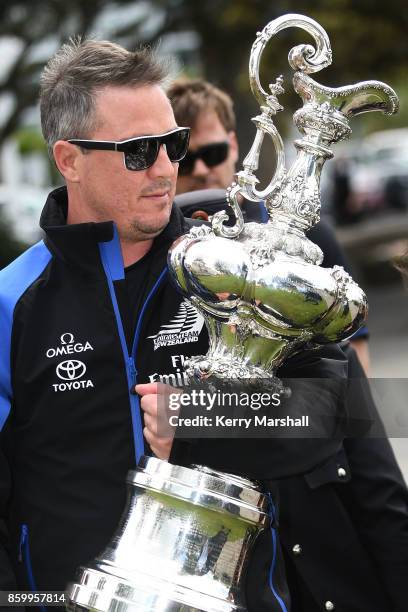 Steve Collie carries the America's Cup along the Marine Parade before the civic reception during the America's Cup Regional Tour on October 11, 2017...