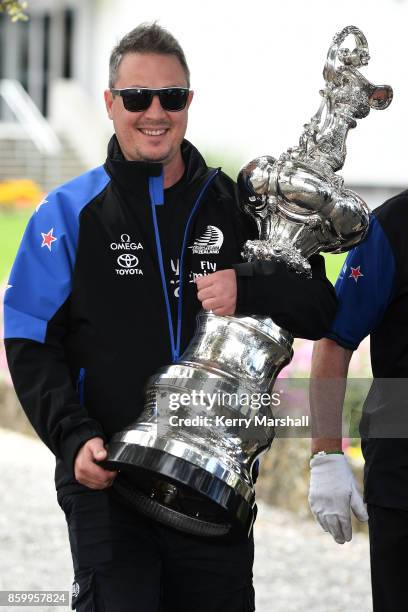 Steve Collie carries the America's Cup along the Marine Parade before the civic reception during the America's Cup Regional Tour on October 11, 2017...