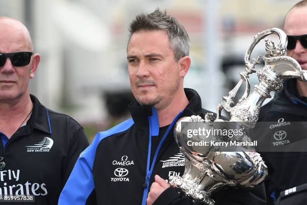 Steve Collie carries the America's Cup along the Marine Parade before the civic reception during the America's Cup Regional Tour on October 11, 2017...