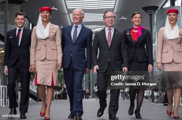 Sir Tim Clark, President of Emirates Airline and Alan Joyce, Qantas Group CEO at Qantas headquarters with two cabin crew from each airline on October...