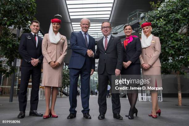 Sir Tim Clark, President of Emirates Airline and Alan Joyce, Qantas Group CEO at Qantas headquarters with two cabin crew from each airline on October...
