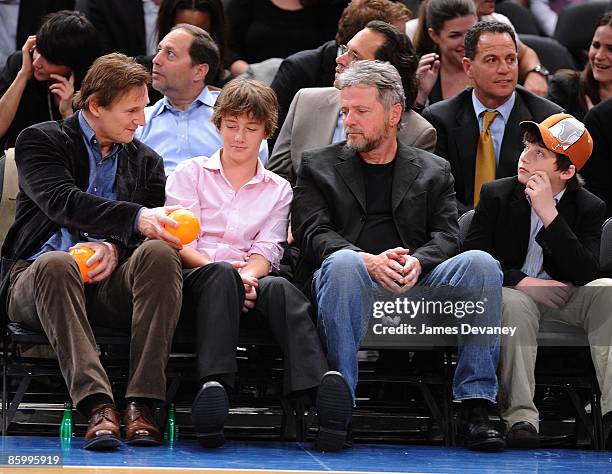 Liam Neeson, Michael Neeson, Aidan Quinn and Daniel Neeson attend New Jersey Nets vs New York Knicks game at Madison Square Garden on April 15, 2009...