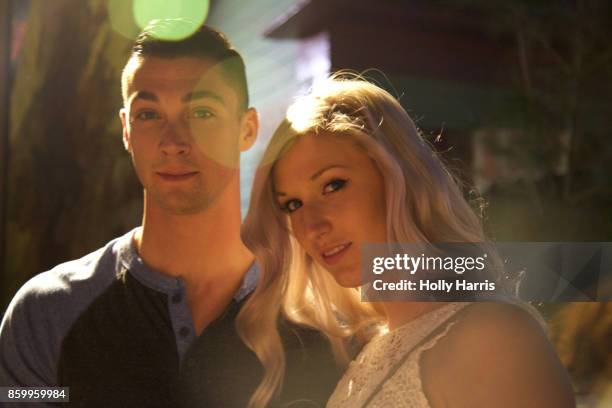 portrait of couple, circular lens flare at night - portrait lens flare stock pictures, royalty-free photos & images