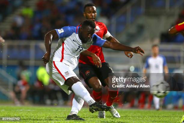 Jozy Altidore of the United States mens national team has a shot at goal as Khaleem Hyland of Trinidad and Tobago attempts to block the shot during...