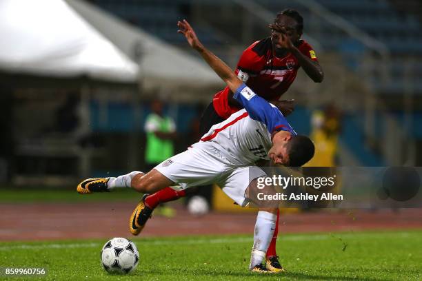 Christian Pulisic of the United States mens national team battles for control of the ball with Nathan Lewis of Trinidad and Tobago during the FIFA...