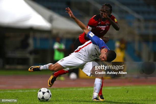 Christian Pulisic of the United States mens national team battles for control of the ball with Nathan Lewis of Trinidad and Tobago during the FIFA...