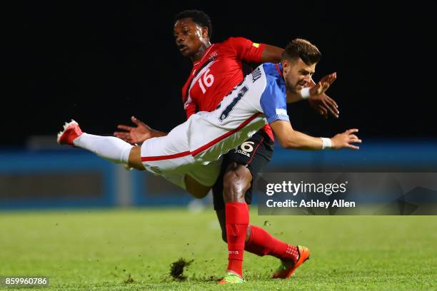 Paul Arriola of the United States mens national team is tackled by Levi Garcia of Trinidad and Tobago during the FIFA World Cup Qualifier match...