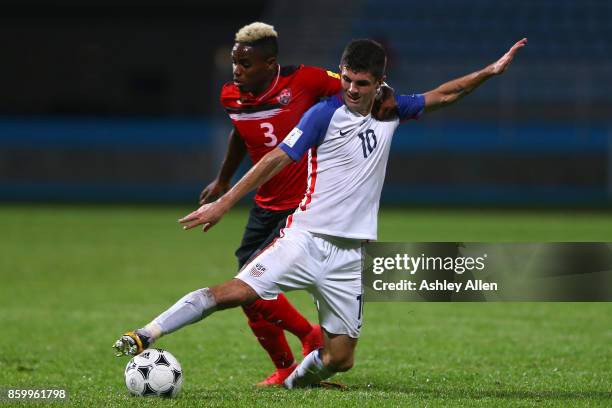 Christian Pulisic of the United States mens national team battles for control of the ball with Jovan Jones of Trinidad and Tobago during the FIFA...