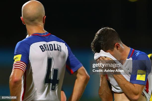 Michael Bradley and Christian Pulisic of the United States mens national team react to their loss against Trinidad and Tobago during the FIFA World...