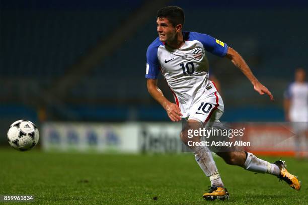 Christian Pulisic of the United States mens national team runs with the ball during the FIFA World Cup Qualifier match between Trinidad and Tobago at...
