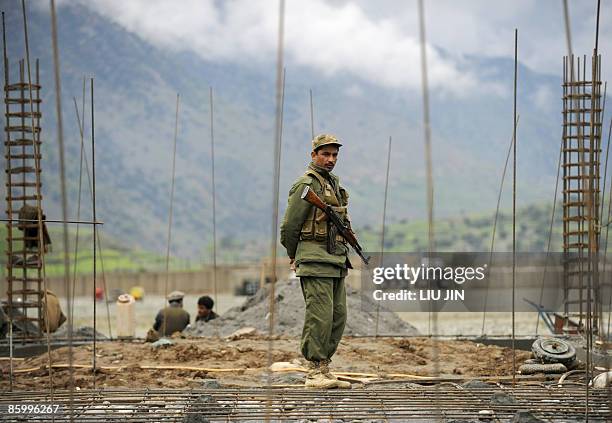 Afghanistan-unrest-military-security, FOCUS by Charlotte McDonald-Gibson An Afghan National Army soldier stands guard at the ISAF's Camp Bostick in...