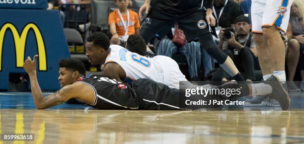 Dillion Stith of the Melbourne United and Semaj Christon of the Oklahoma City Thunder battle for a ball during the second half of a NBA preseason...