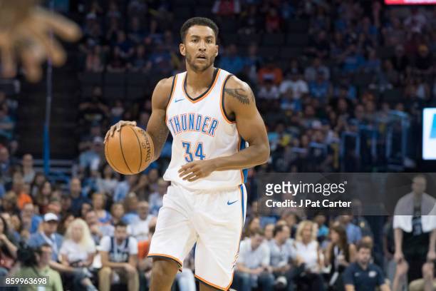 Josh Huestis of the Oklahoma City Thunder brings the ball up court against the Melbourne United during the first half of a NBA preseason game at the...
