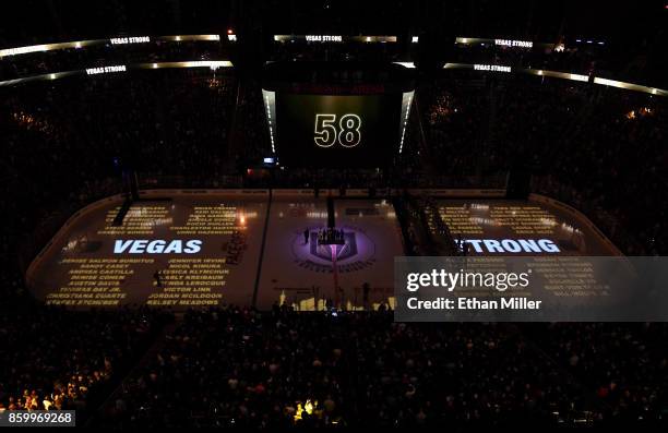 The names of the 58 people killed at the Route 91 Harvest country music festival are projected on the ice before the Vegas Golden Knights' inaugural...