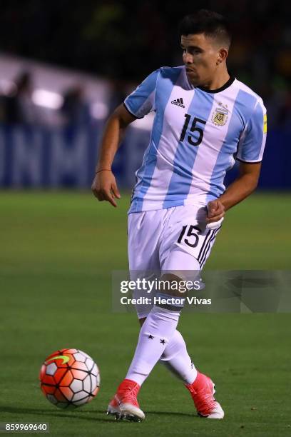 Marcos Acuña of Argentina drives the ball during a match between Ecuador and Argentina as part of FIFA 2018 World Cup Qualifiers at Olimpico...